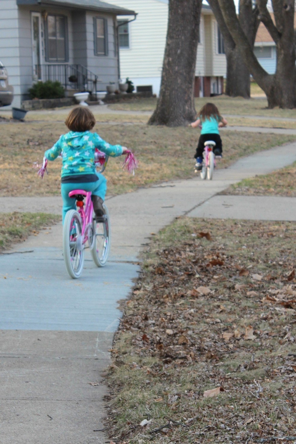 My little girls riding their bikes in the neighborhood last year: June was 6 and Rory was 4. 