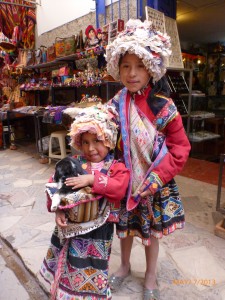 These Peruvian munchkins reminded me so much of my own girls, down to the big one bossing the little one around!