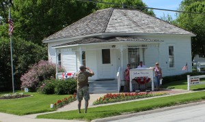 Taking pictures in front of the house. 