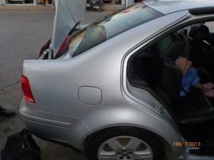 The car we were supposed to fit into. Notice the back seat being pushed forward by the luggage.